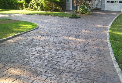 Weathered looking stamped concrete driveway.