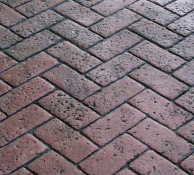 Red brick stamp in a zigzag shape.