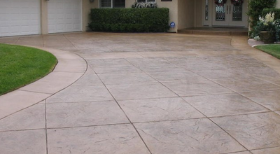 Stamped concrete driveway, and front porch.