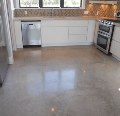 Stained and polished interior concrete kitchen floor.