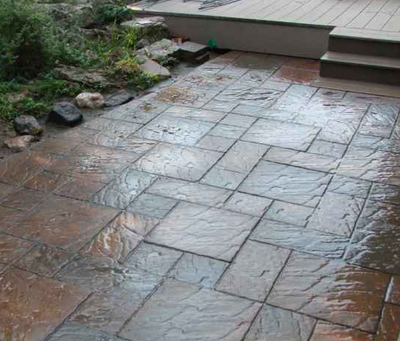 Stamped patio made to look like stone pavers.