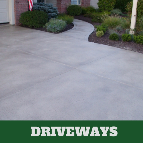 Concrete driveway with a dark gray color additive and concrete sealer.