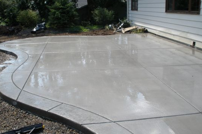 Polished concrete patio with stamped concrete border.